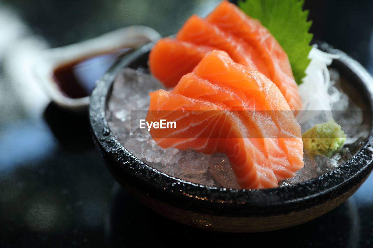 CLOSE-UP OF FRESH FISH IN CONTAINER