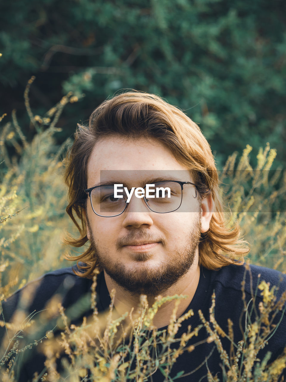 Portrait of a young man in the grass