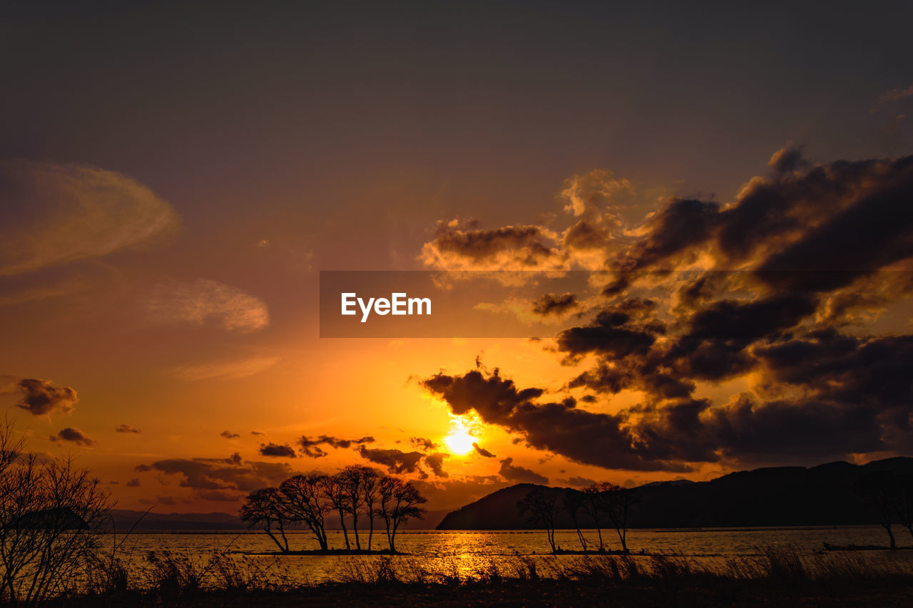 SCENIC VIEW OF SUNSET OVER LAND