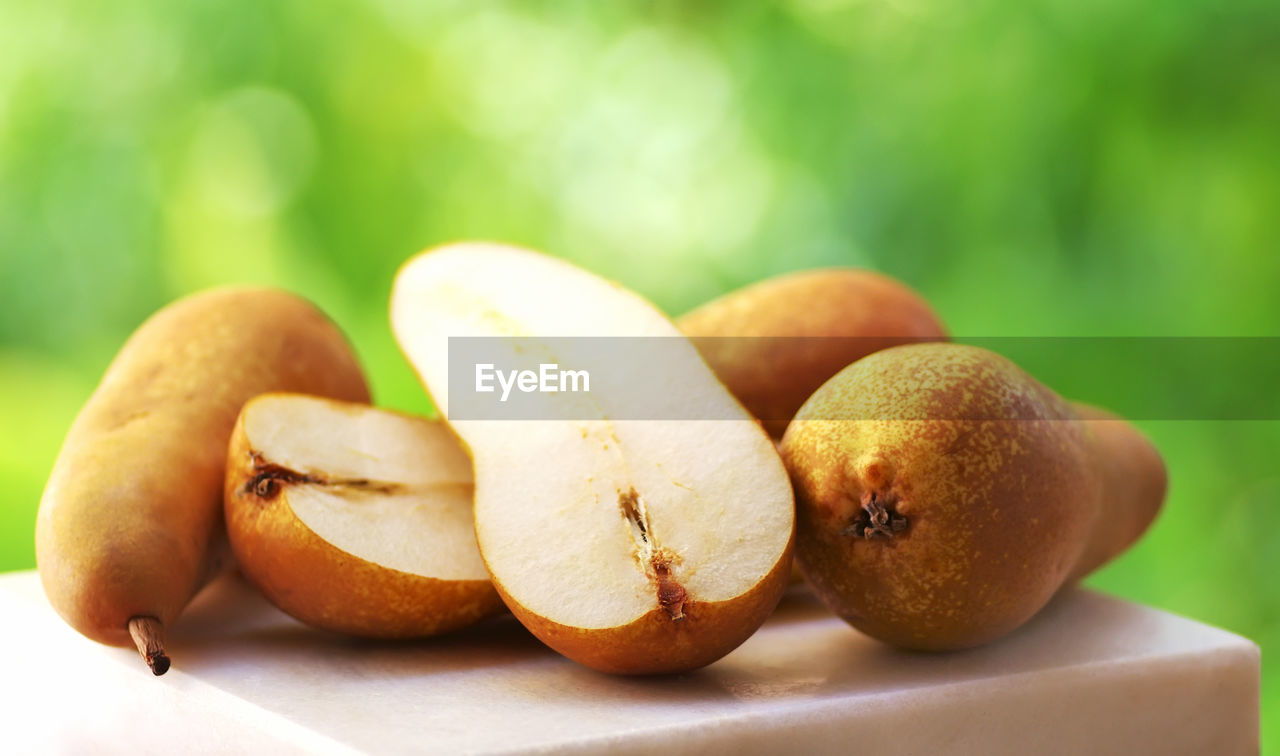 Close-up of pears on stool