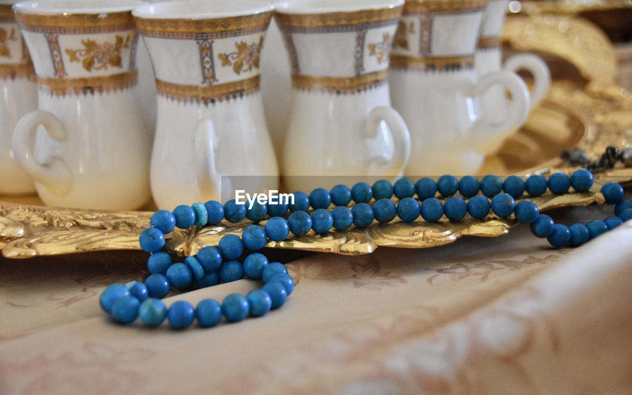 Close-up of bead necklace on table