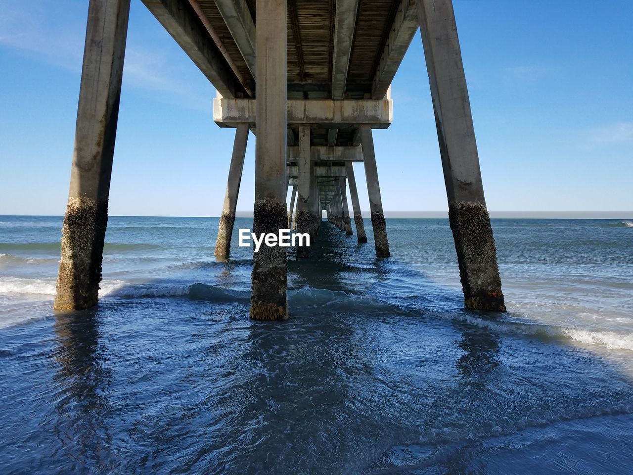 Pier on sea against sky