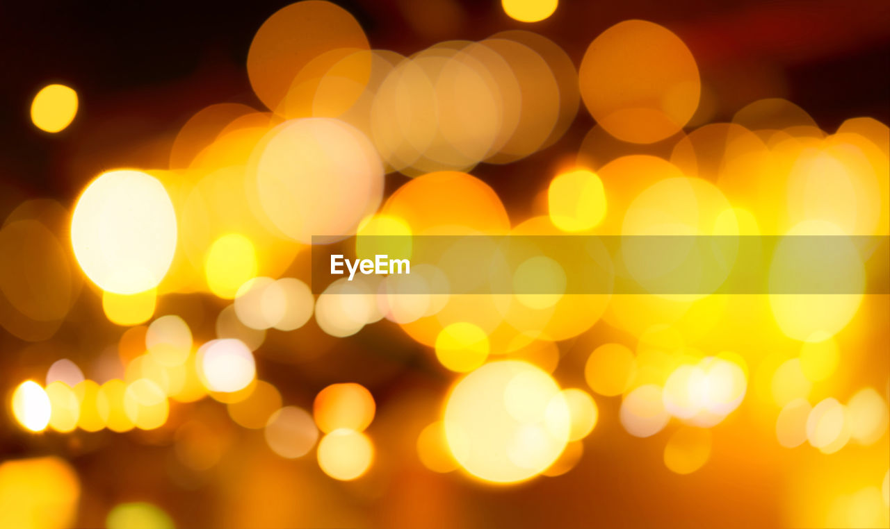 Blur gold color bokeh background. blur abstract background of city light. warm light with beautiful