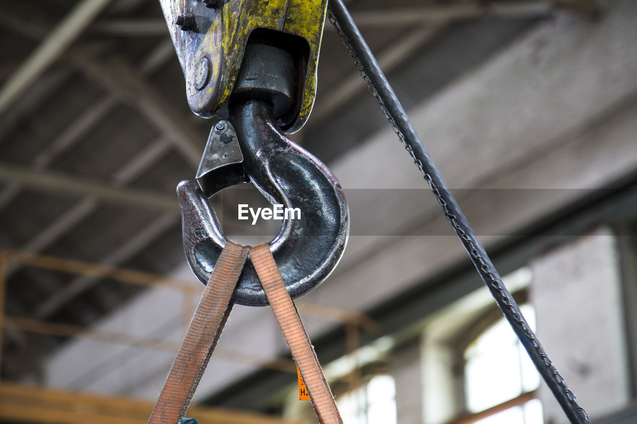 Low angle view of hook at metal industry