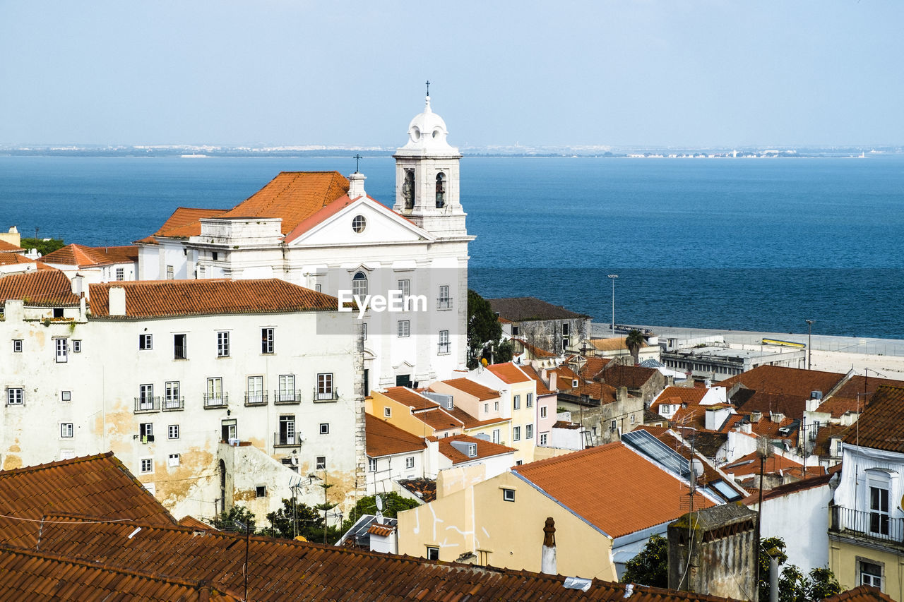 High angle view of church by sea against sky