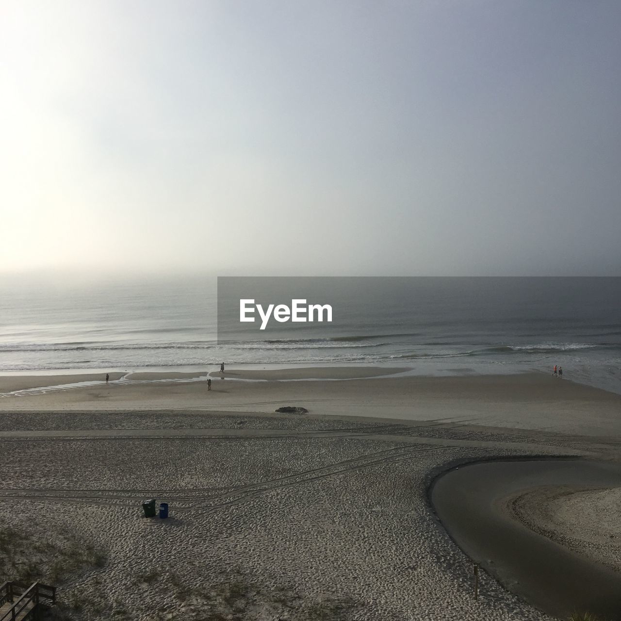 Scenic view of beach against clear sky