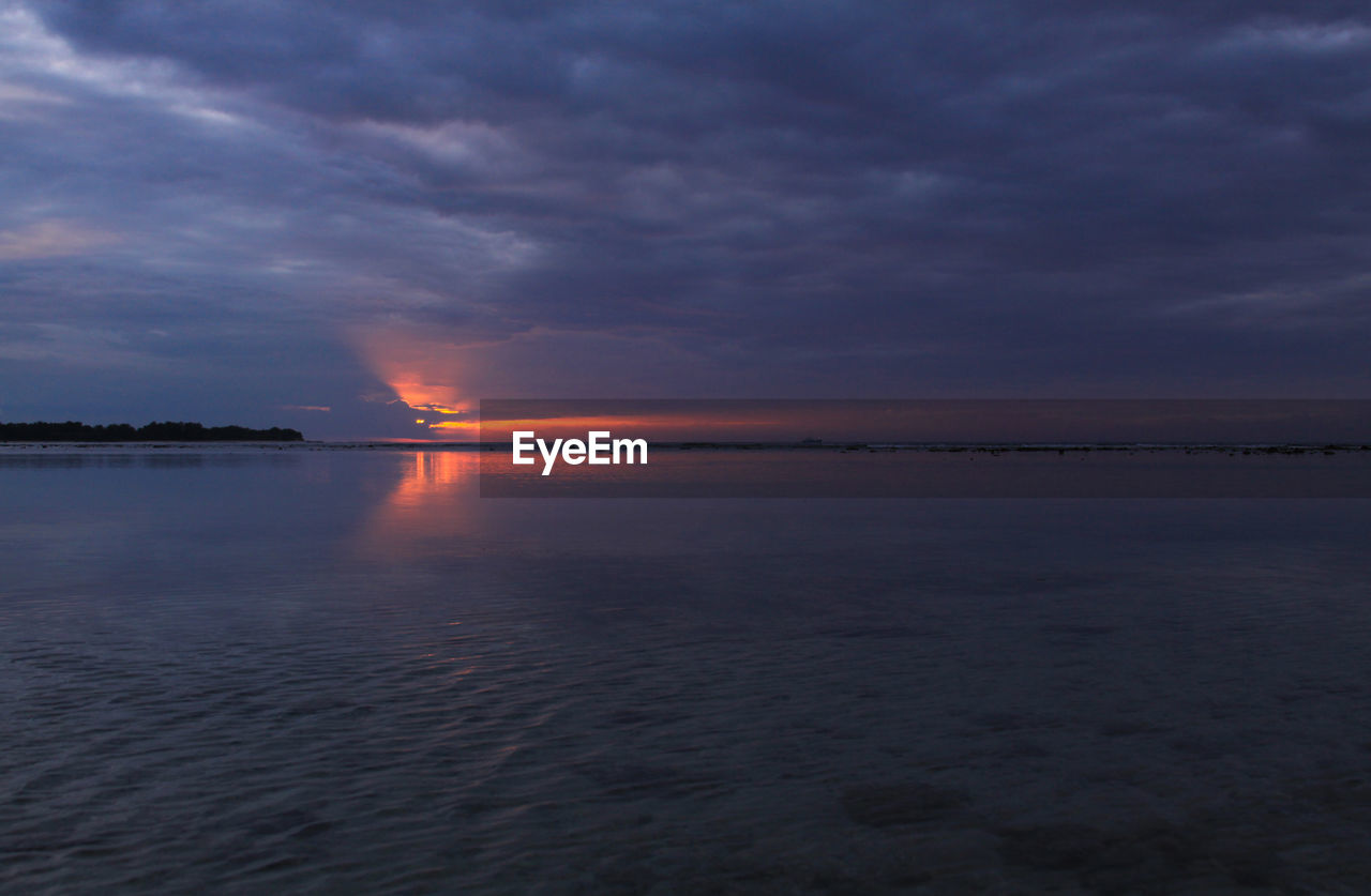 SCENIC VIEW OF SEA DURING SUNSET