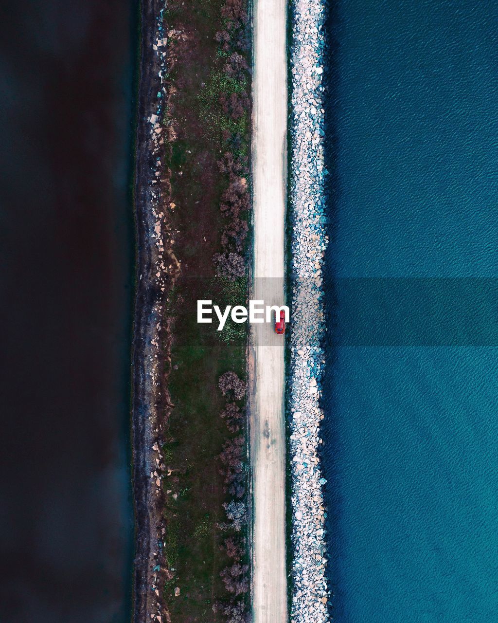 Aerial view of road amidst sea