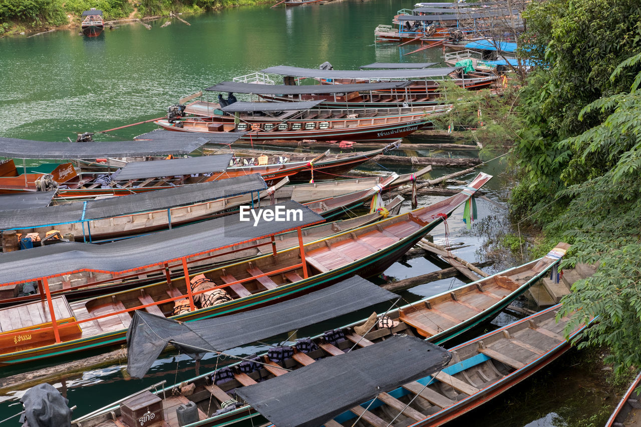 High angle view of long tail boats in water