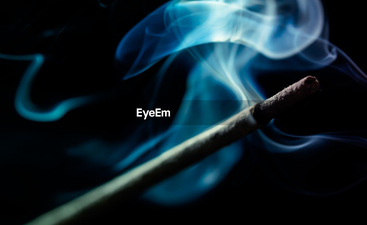 Close-up of burning incense stick 