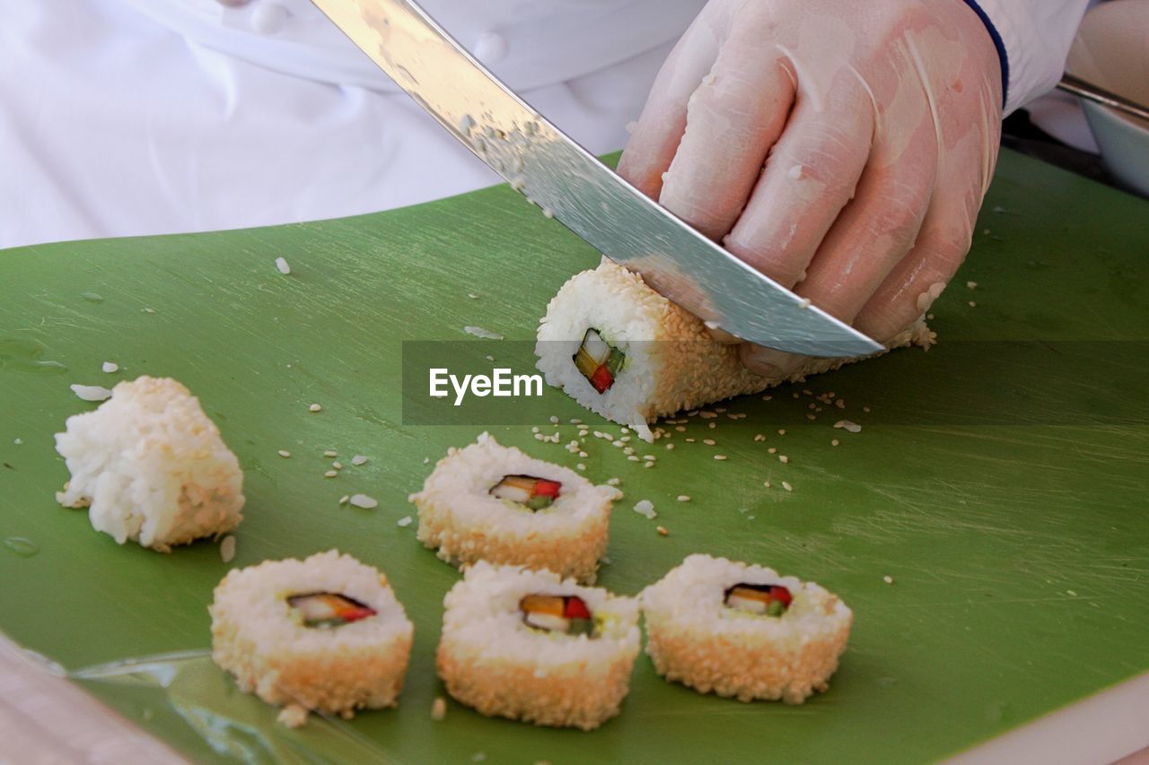 Man slicing sushi