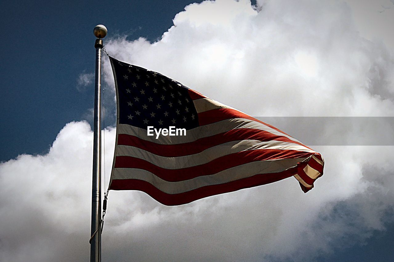 Low angle view of flag against sky