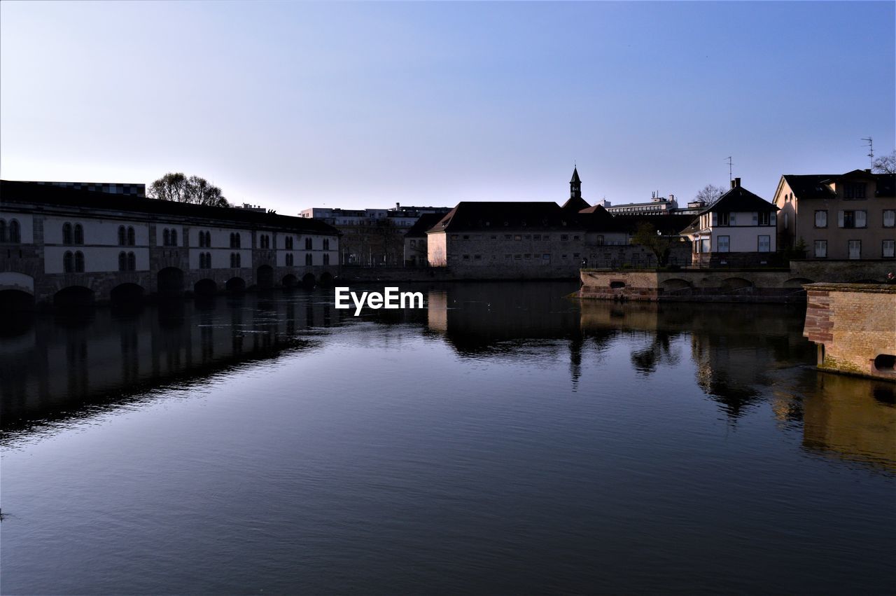 REFLECTION OF HOUSES ON RIVER