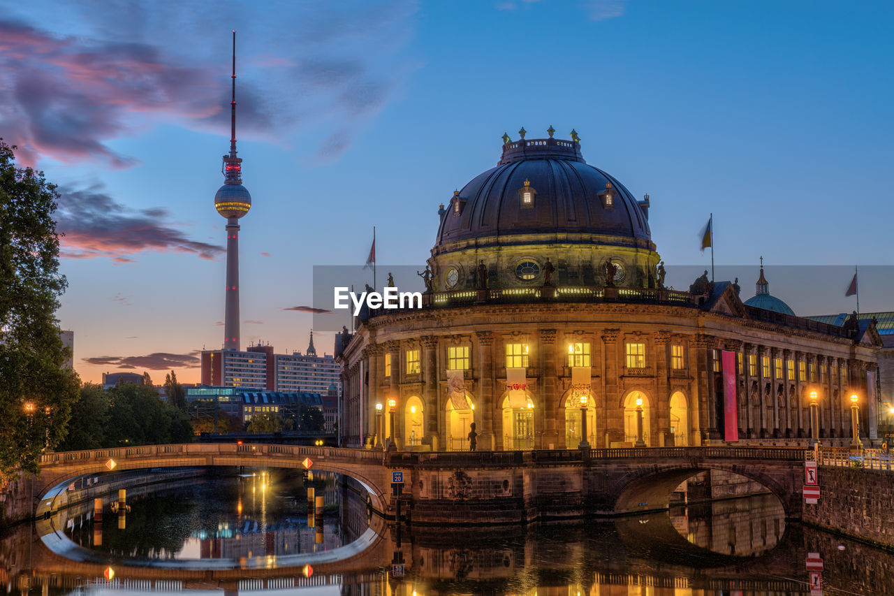 The bode museum in berlin before sunrise with the famous tv tower in the back