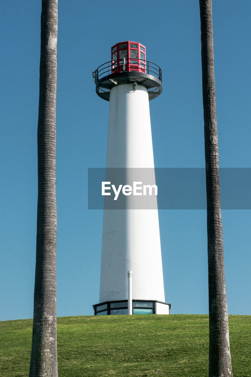 Low angle view of lighthouse against clear blue sky