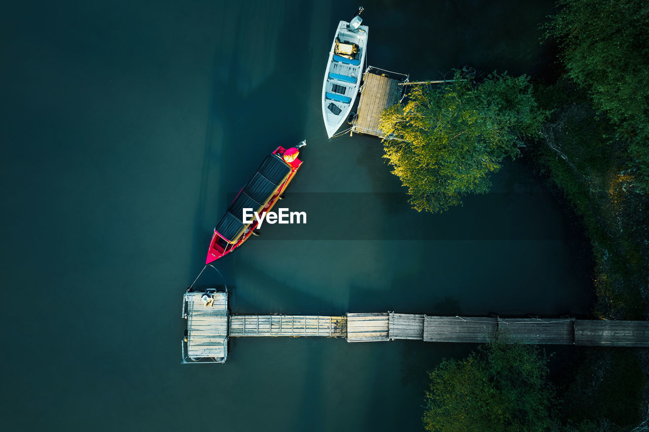 Aerial view of fishing boat by pier