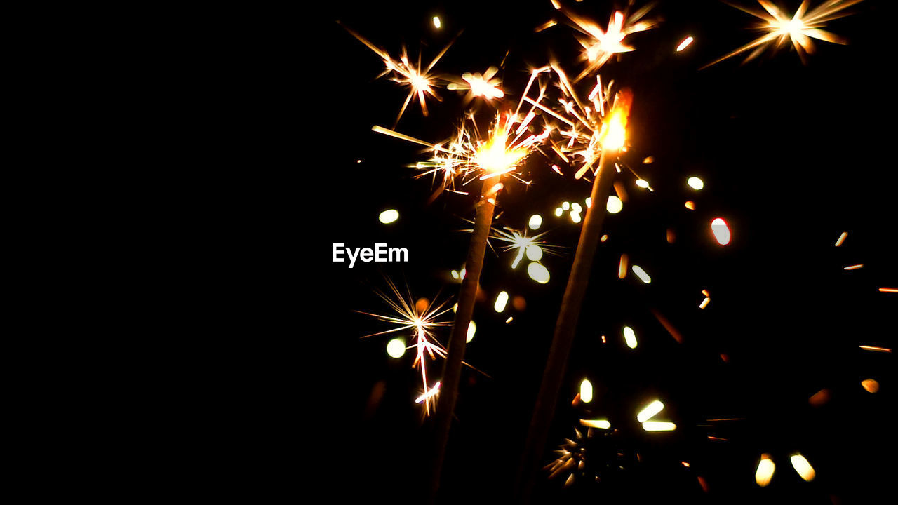 CLOSE-UP OF FIREWORKS AT NIGHT