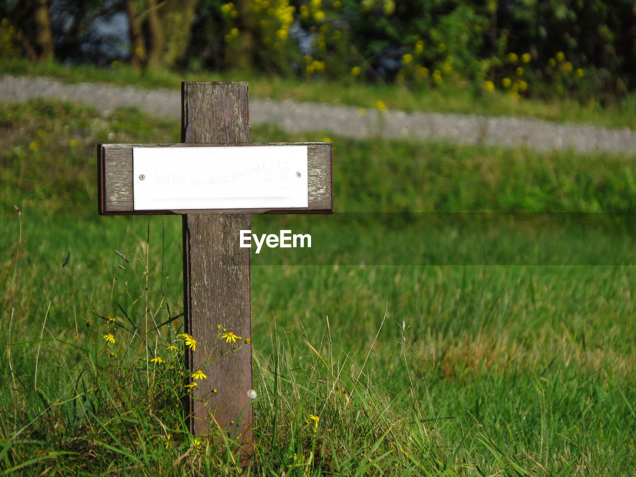 Close-up of cross on field