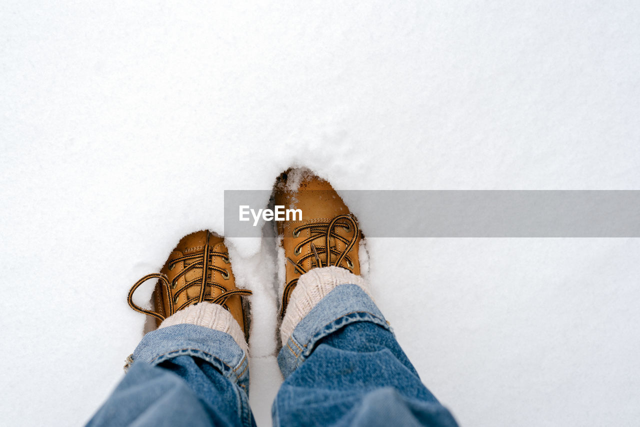 Boots in the snow, top view.