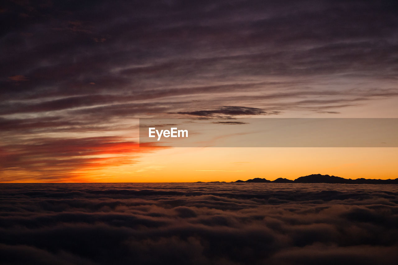 scenic view of landscape against sky during sunset