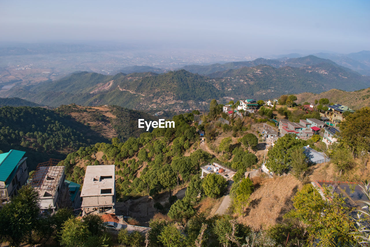 high angle view of houses and mountains against sky