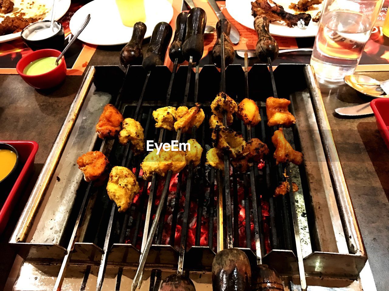 CLOSE-UP OF VARIOUS FLOWERS ON BARBECUE