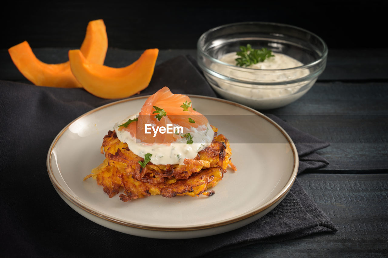 food and drink, food, healthy eating, dish, plate, wellbeing, freshness, meal, breakfast, vegetable, produce, no people, cuisine, indoors, studio shot, fruit, fast food, black background, herb, egg, gourmet, savory food, meat, fish, orange color, seafood