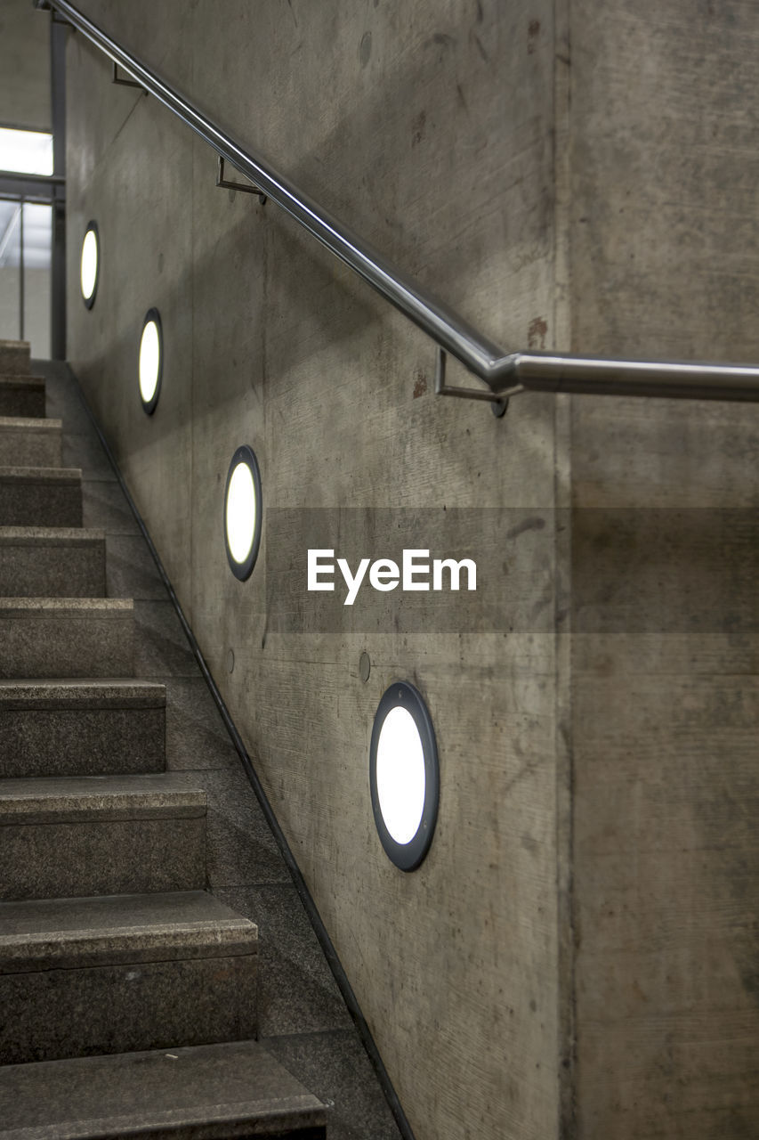 Low angle view of illuminated electric light on staircase