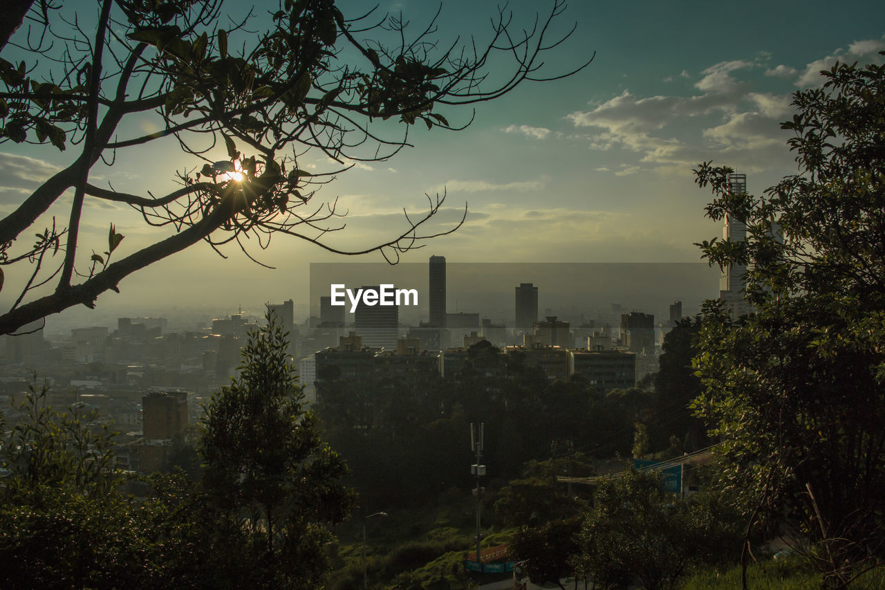 Cityscape against sky during sunset