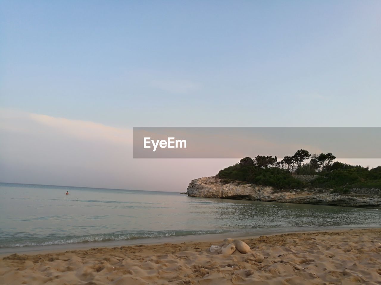 Scenic view of beach and sea against sky