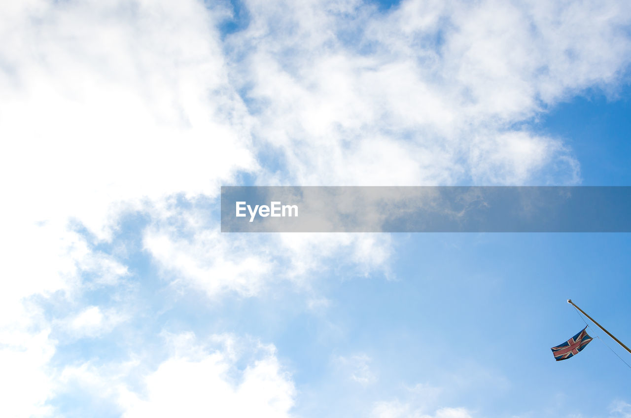 LOW ANGLE VIEW OF TELEPHONE POLE AGAINST SKY