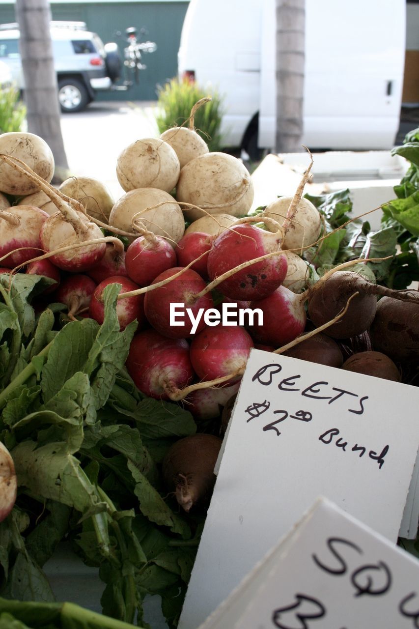 Fresh vegetables with label at market stall