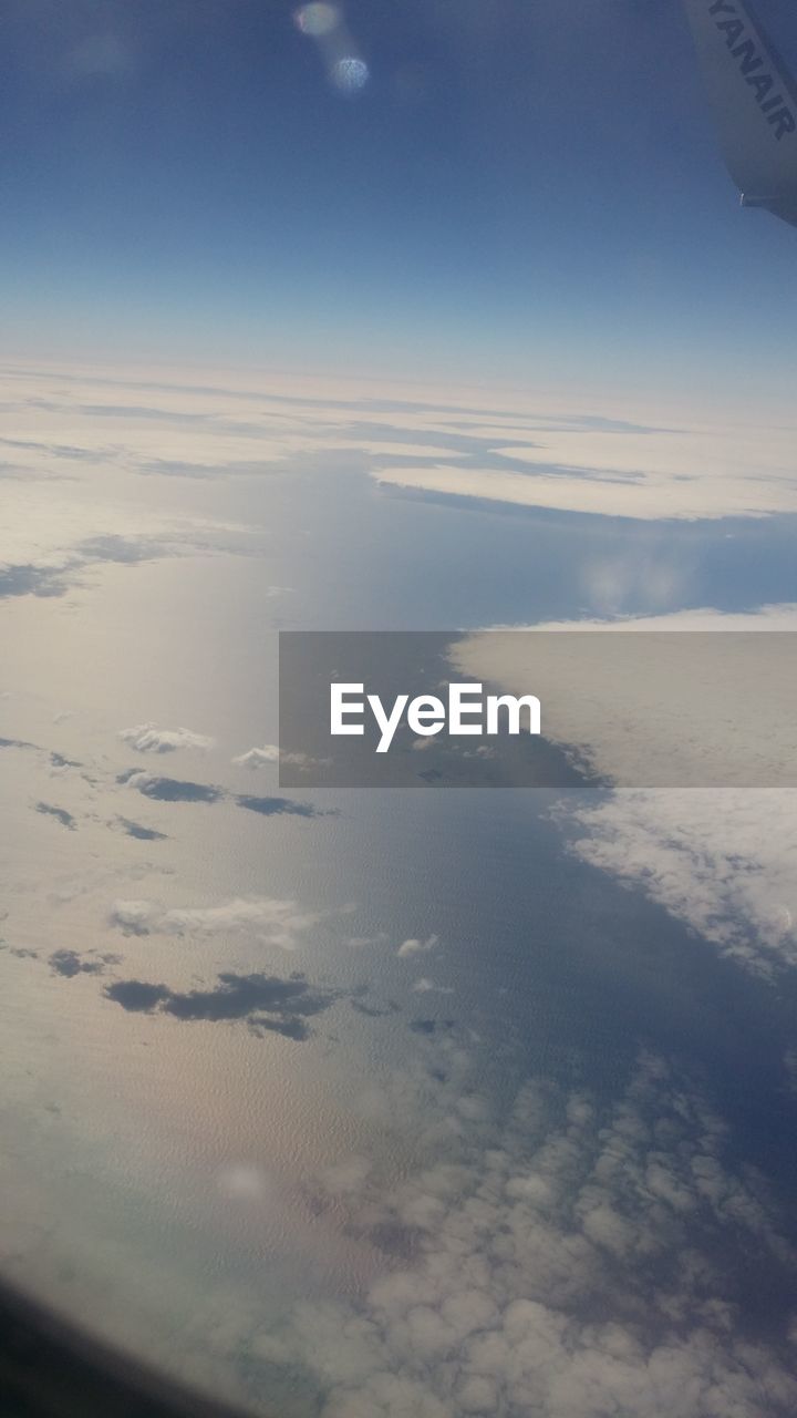 AERIAL VIEW OF CLOUDS OVER LANDSCAPE