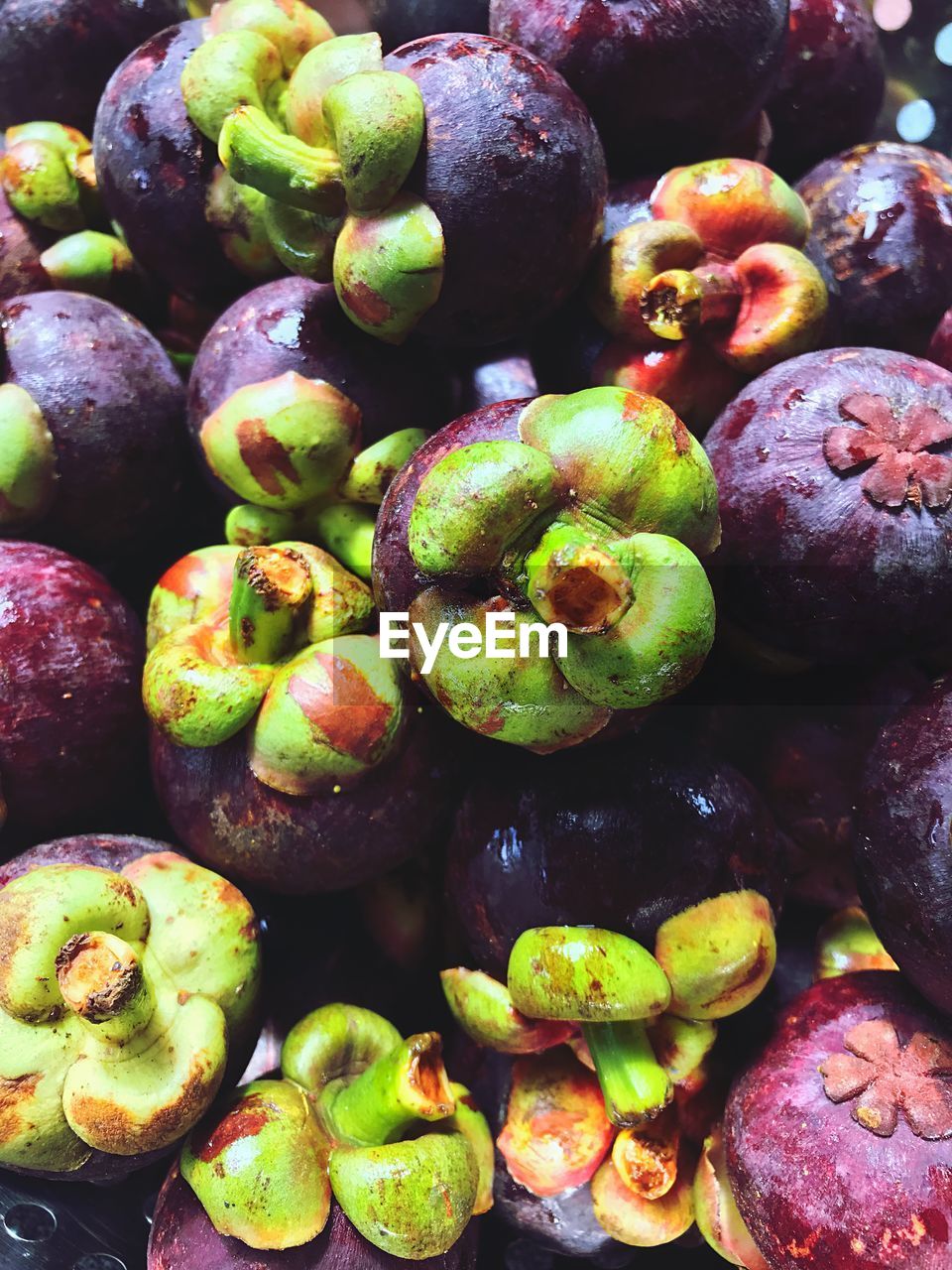 Full frame shot of mangosteens in market