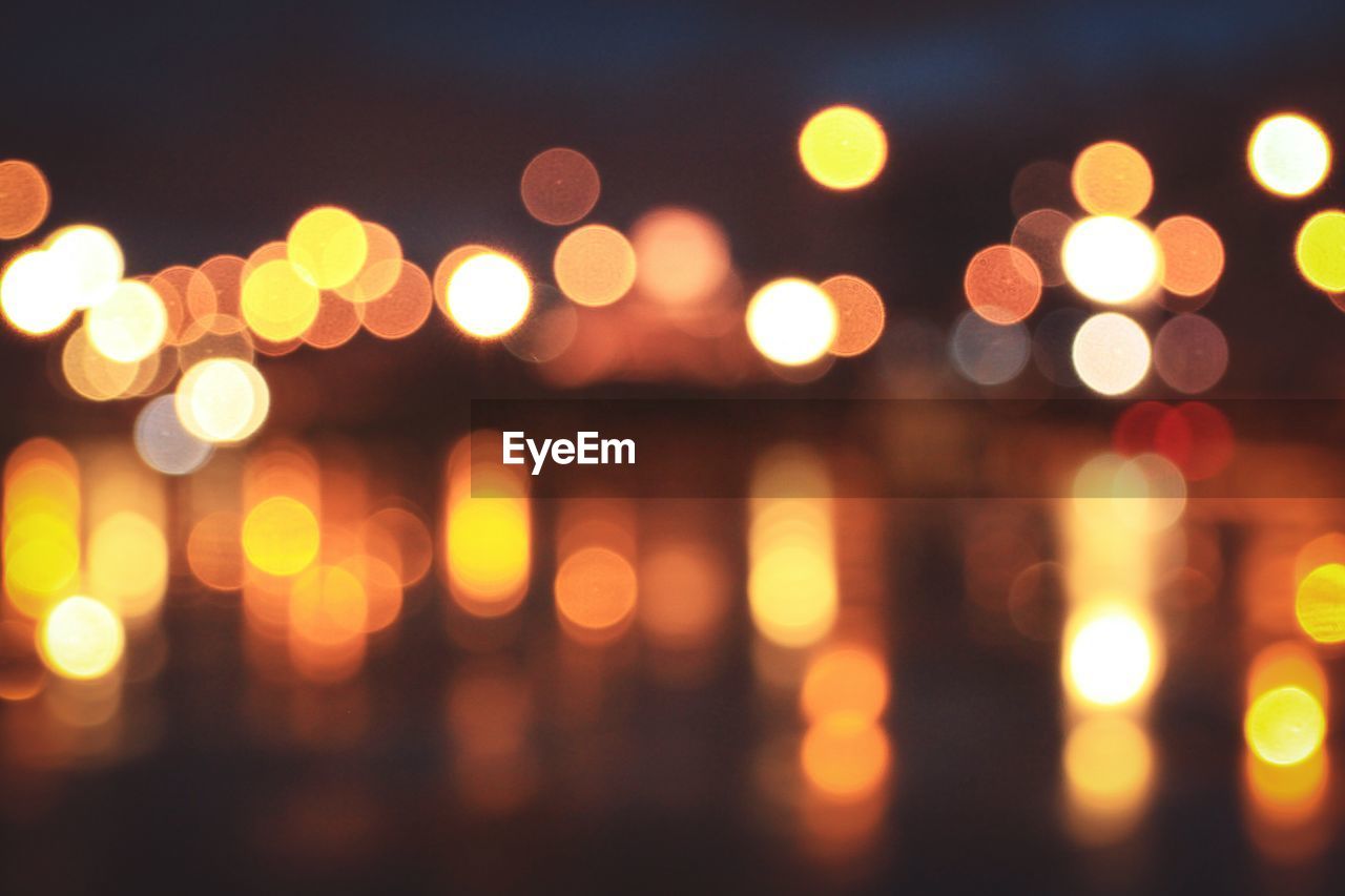 Defocused image of illuminated lights at night