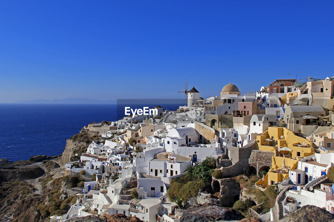 The beautiful village of oia on santorini with the typical greek white houses