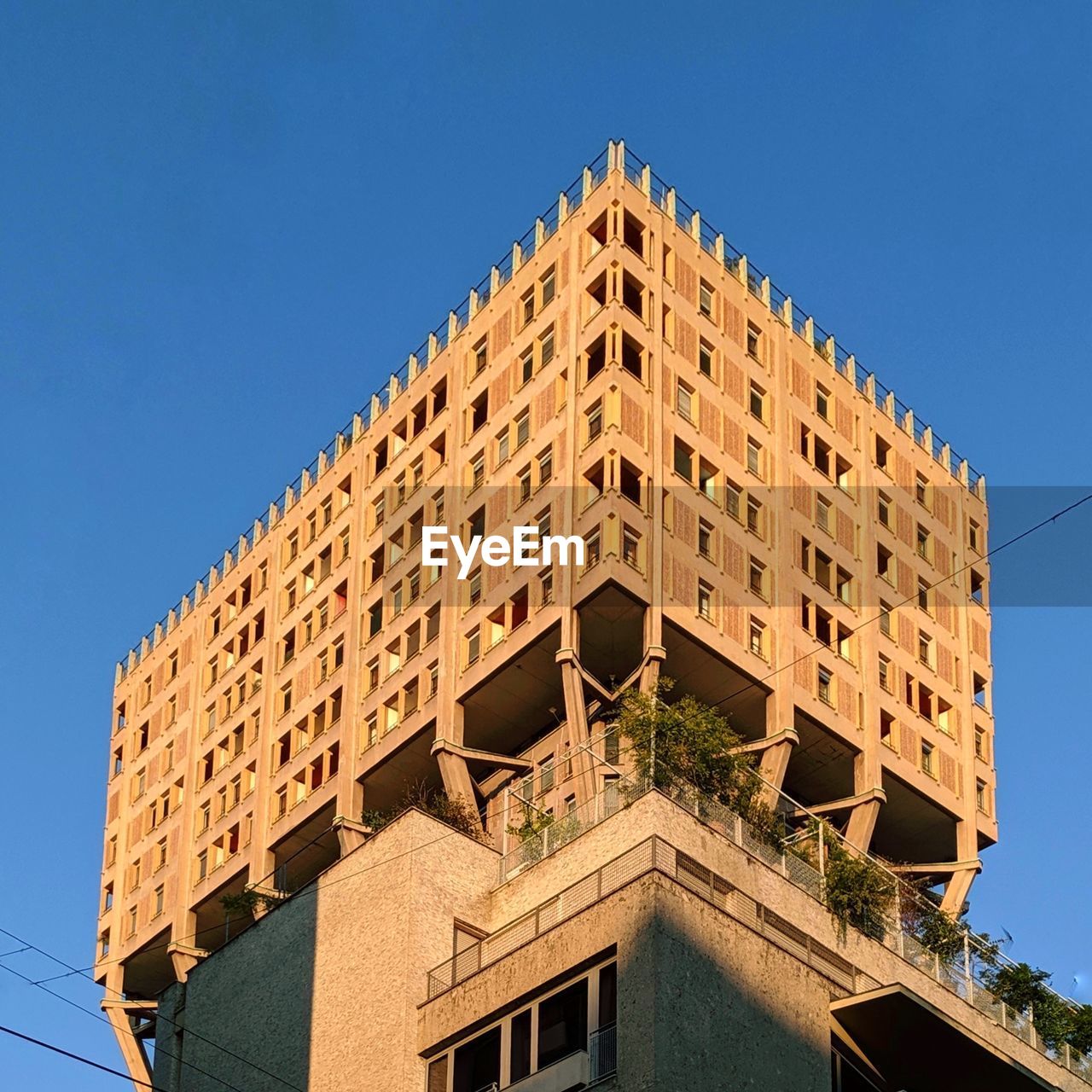 Low angle view of torre velasca against blue sky