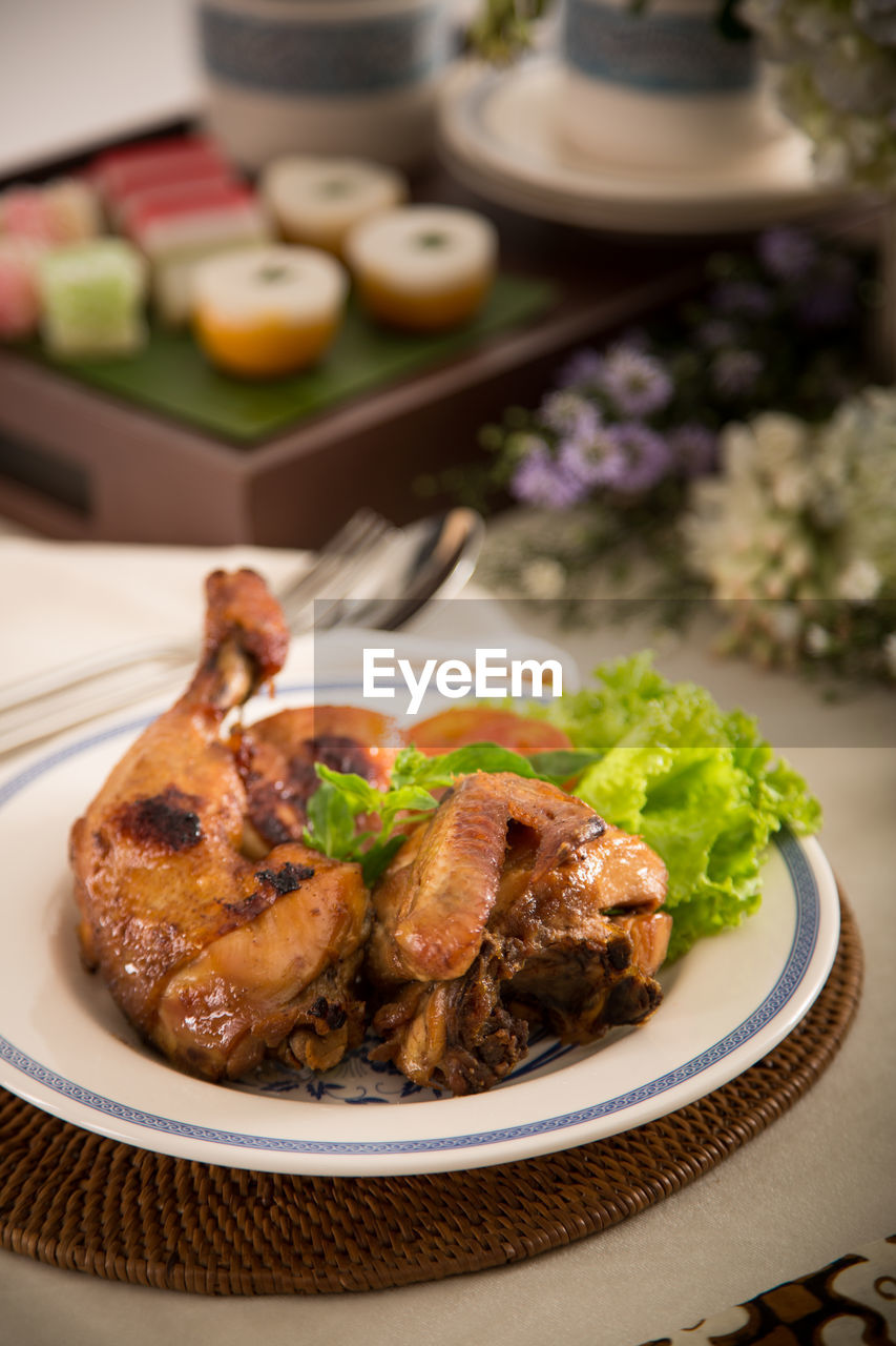 Close-up of fried chicken served on table