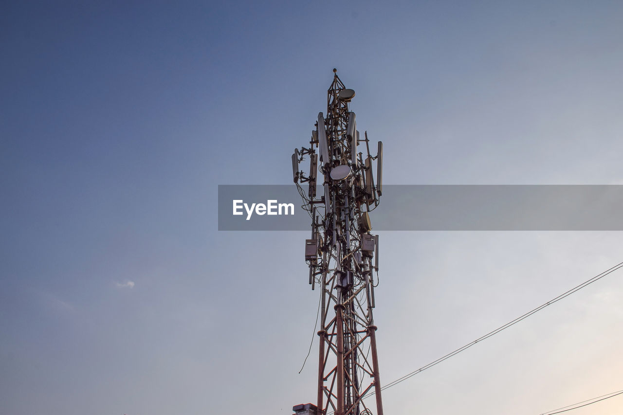 low angle view of electricity pylon against sky