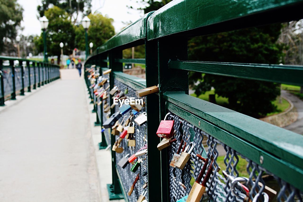 Close-up of love locks at bridge