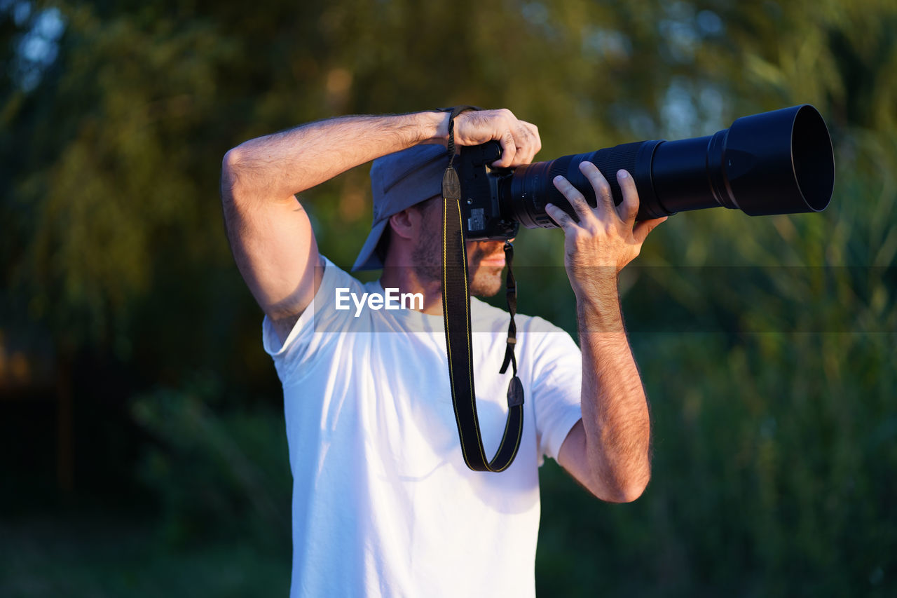 Midsection of man photographing