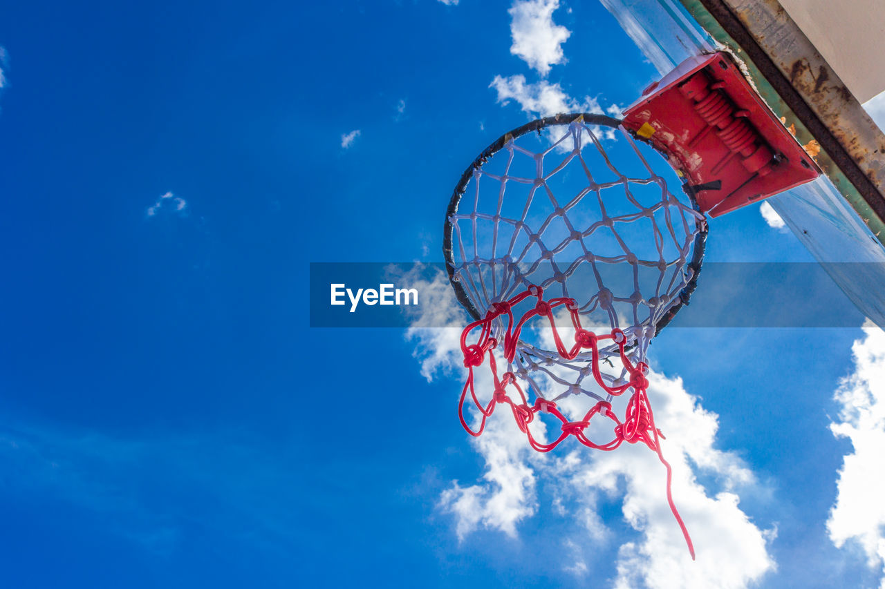 Low angle view of basketball hoop against sky