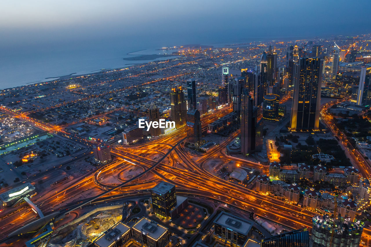 High angle view of illuminated cityscape at night