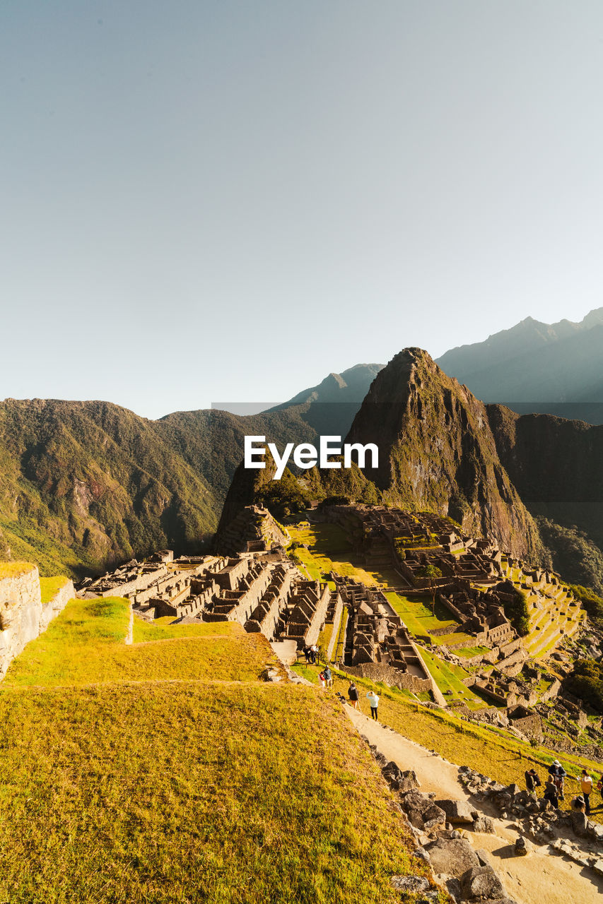 Machu picchu old inca ruins at sunrise in peru