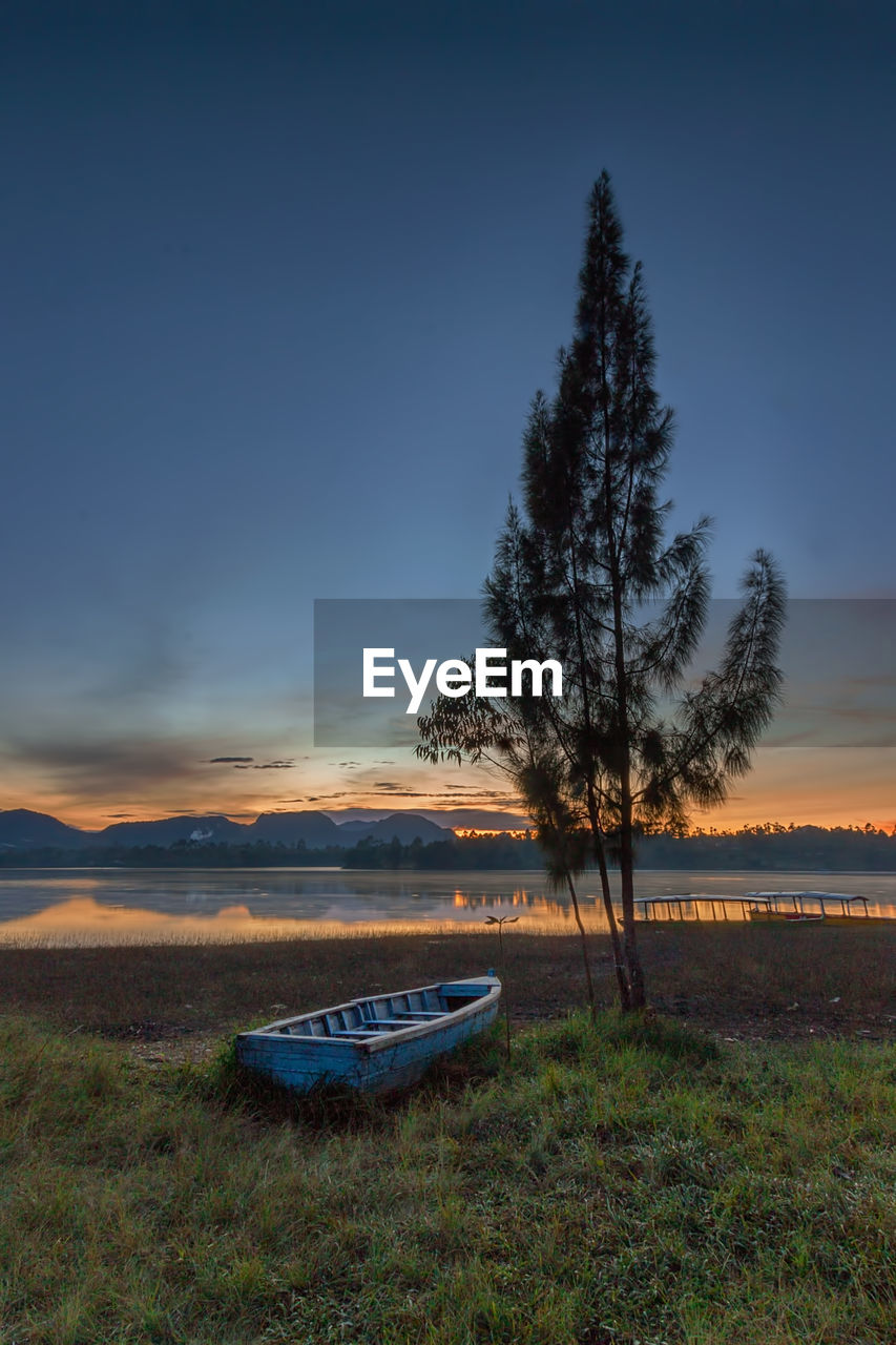 Scenic view of field against sky during sunset