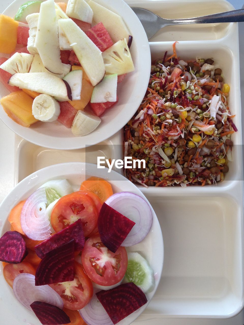 High angle view of chopped fruits in bowl on table