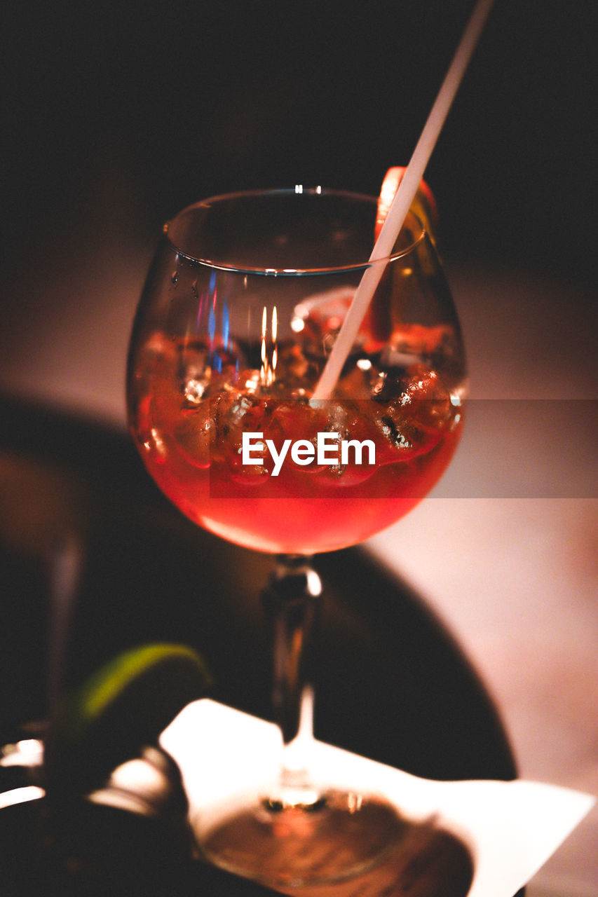 drink, glass, refreshment, food and drink, alcohol, alcoholic beverage, red, household equipment, wine, cocktail, wine glass, drinking glass, indoors, close-up, no people, red wine, distilled beverage, freshness, focus on foreground, macro photography, food, table, stemware, pouring