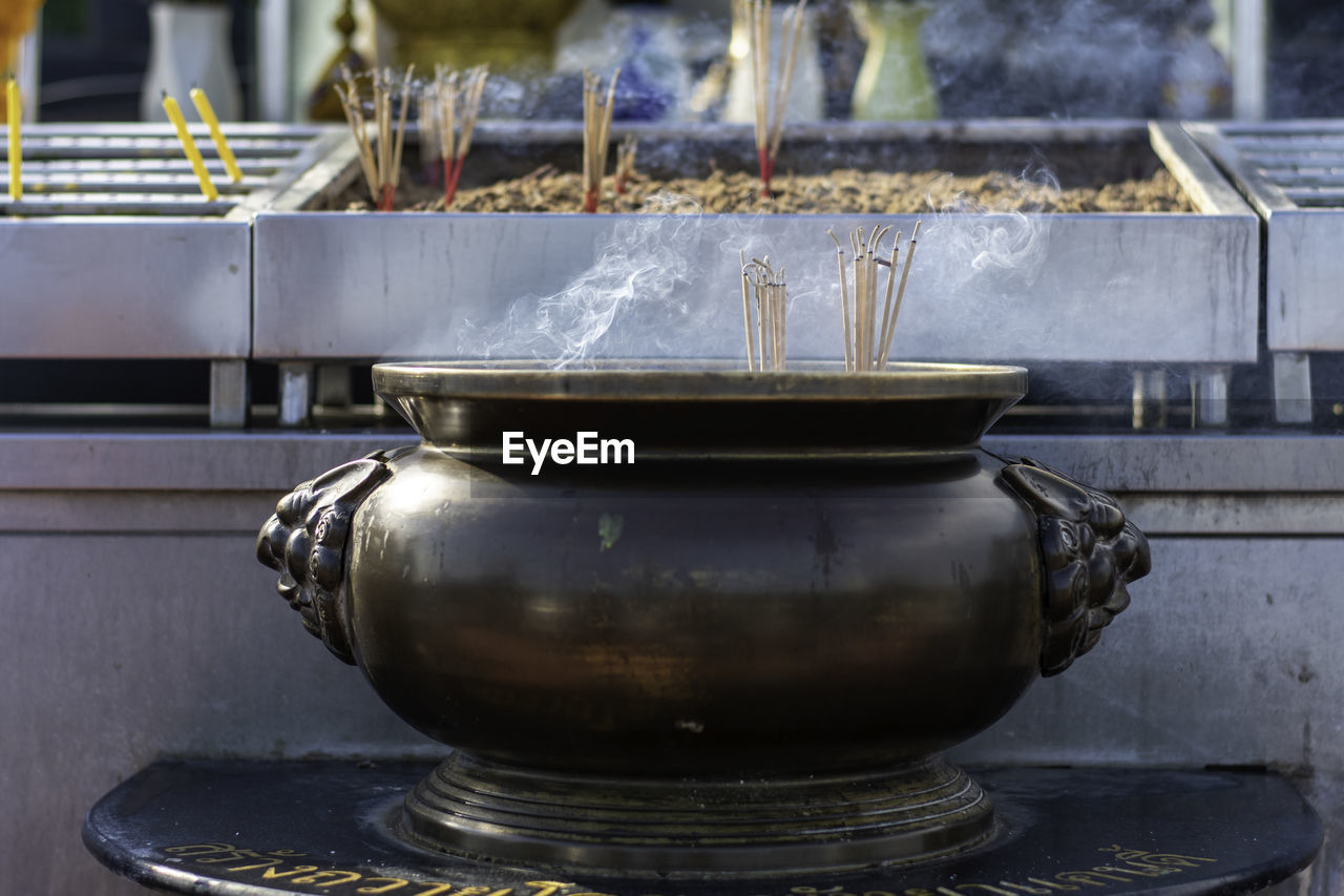 Close-up of pot in temple