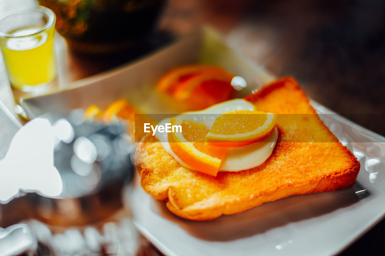 High angle view of orange slice in plate