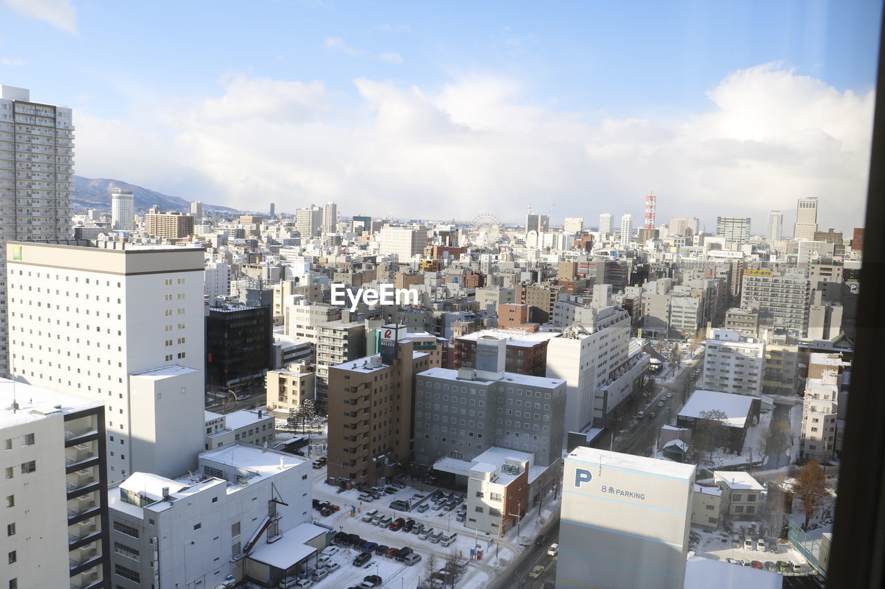 PANORAMIC VIEW OF CITYSCAPE AGAINST SKY